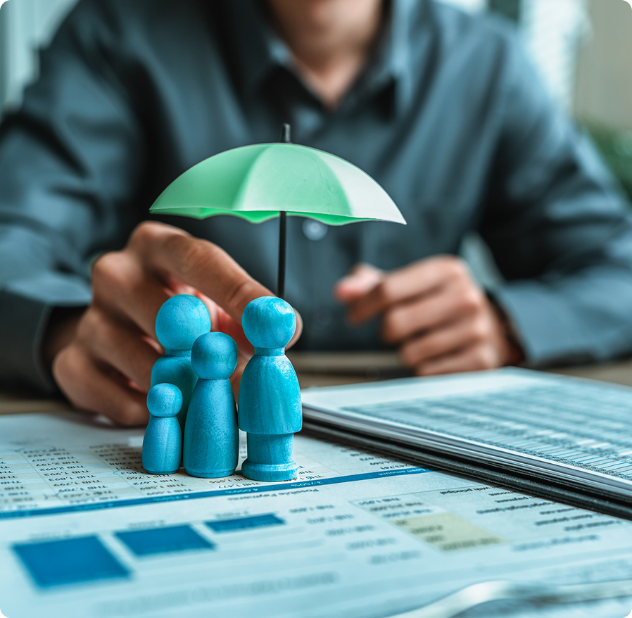 Family figurines under umbrella on documents