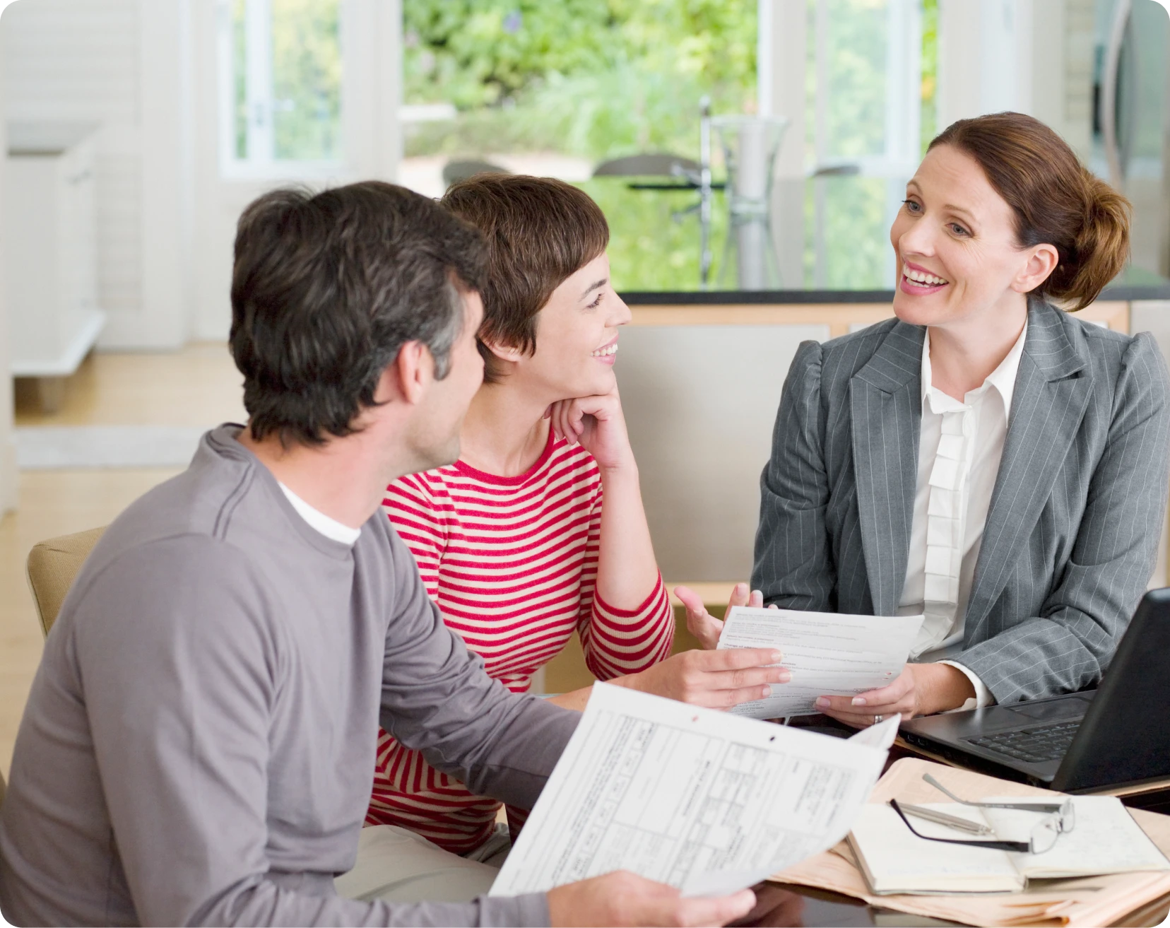 Smiling couple meeting a professional advisor